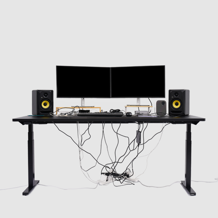 The desk is messed up and full of chaotic cables before using Hexcal Studio monitor stand.