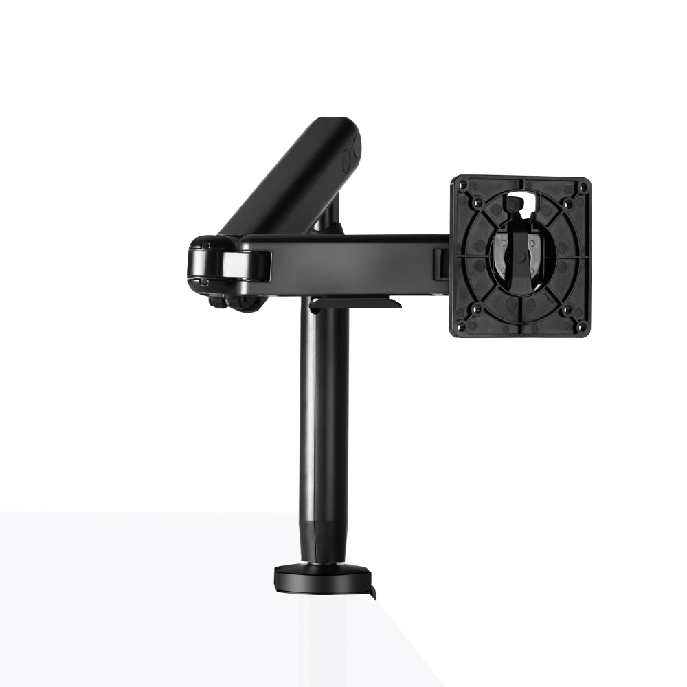 The Single Monitor Arm is clamped to a desk holding no monitor.