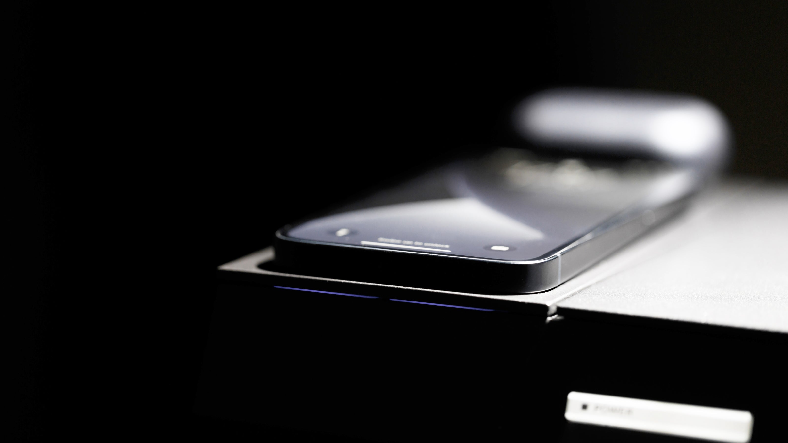 This monitor stand provides wireless charging function for two devices.
